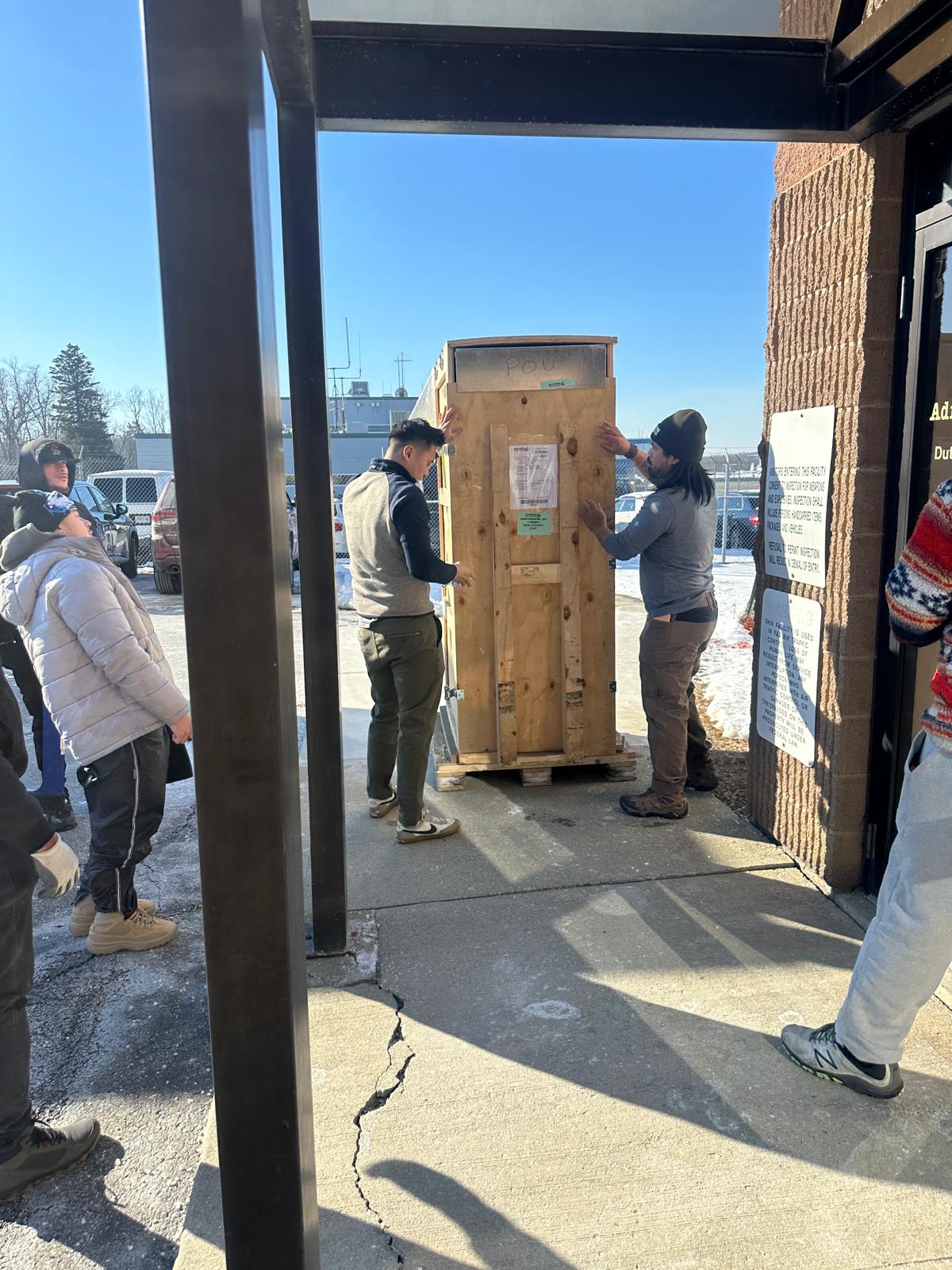 Movers carrying shipment